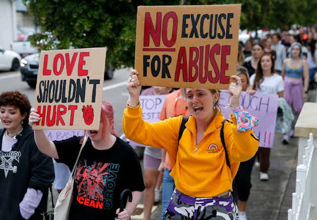 Protesters rally against against gendered violence and domestic violence in Newcastle on Tuesday. 