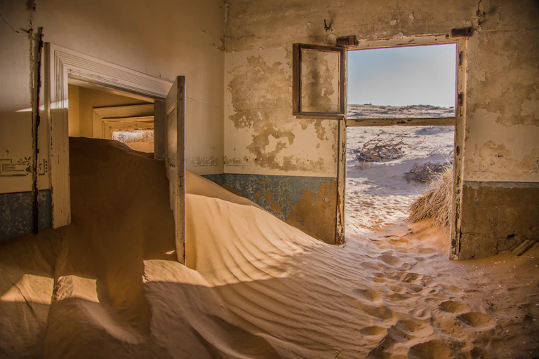 An abandoned house filled with sand
