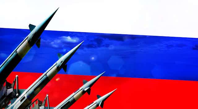 Artwork showing nuclear missiles against the Russian flag.