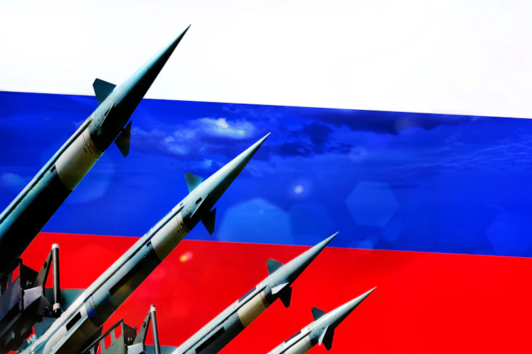 Artwork showing nuclear missiles against the Russian flag.