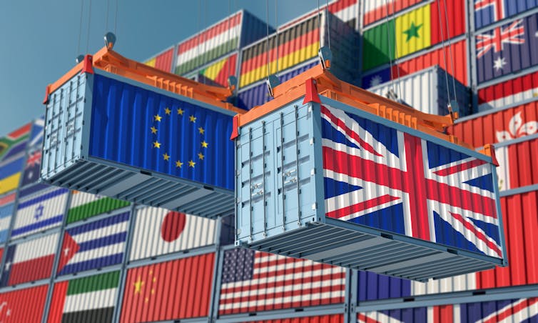 Freight containers bearing EU and UK flags.