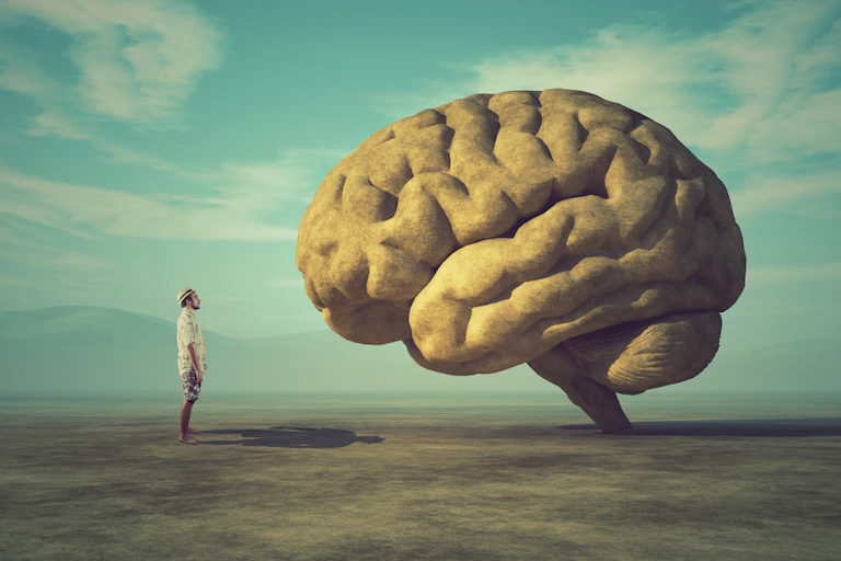 Man staring at oversized brain
