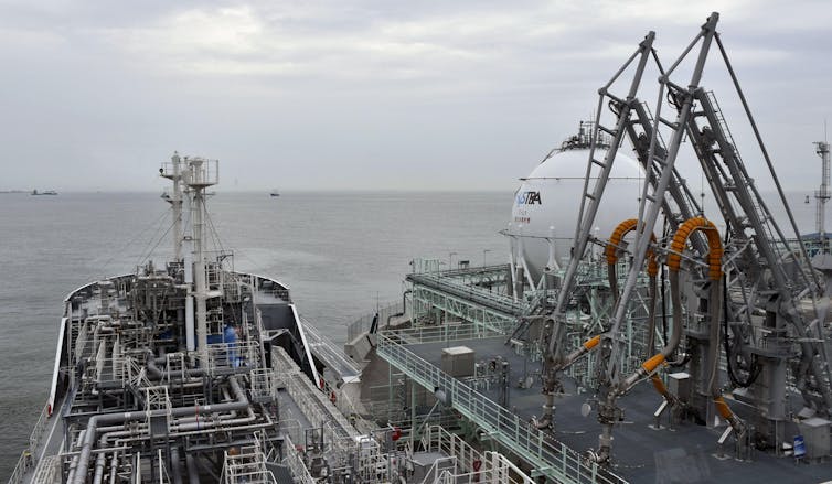 ship at dock with cranes