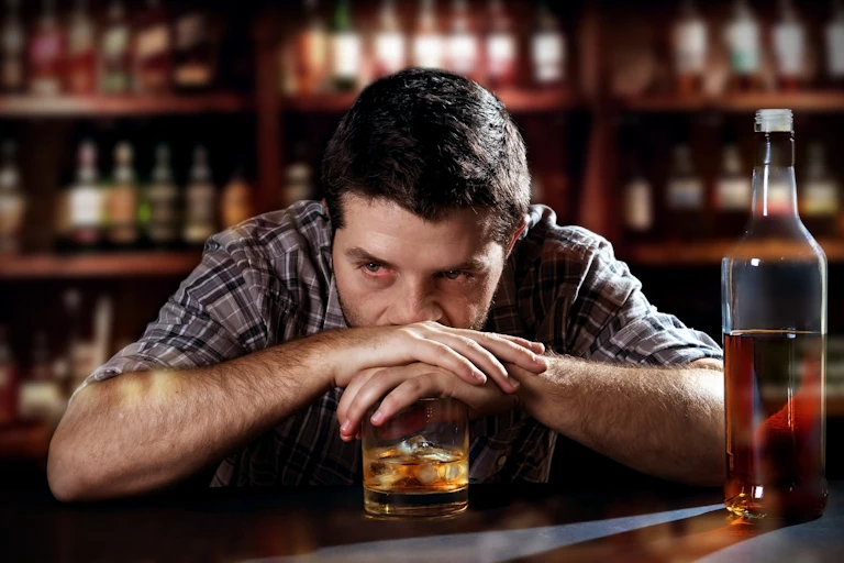 Image of a man drinking alcohol.