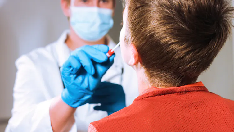 A child being swabbed for COVID