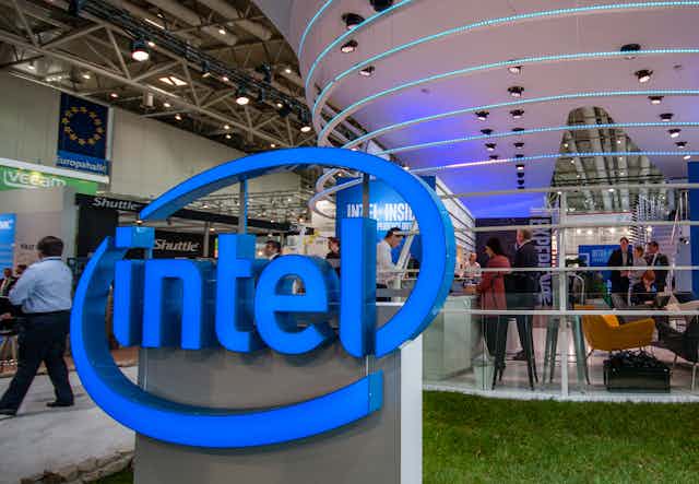 Intel logo in front of European flag at German trade show