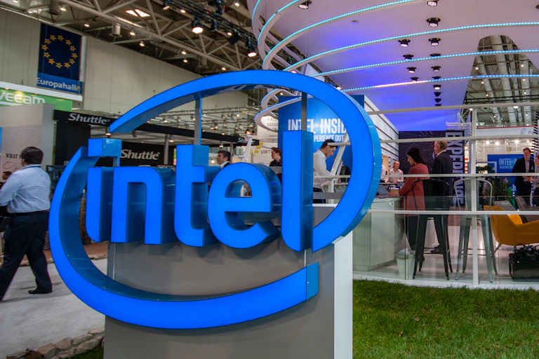 Intel logo in front of European flag at German trade show