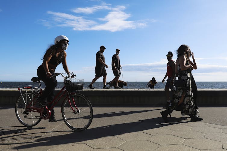 people cycling and walking