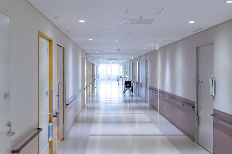 Empty corridor of a large aged care facility.