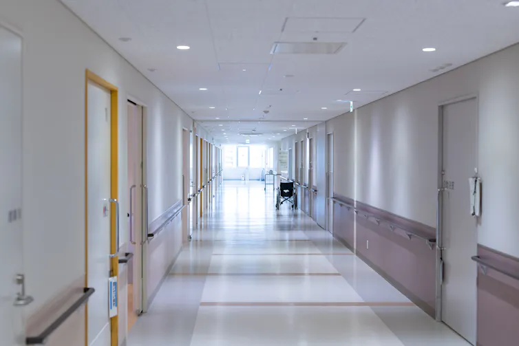 Empty corridor of a large aged care facility.