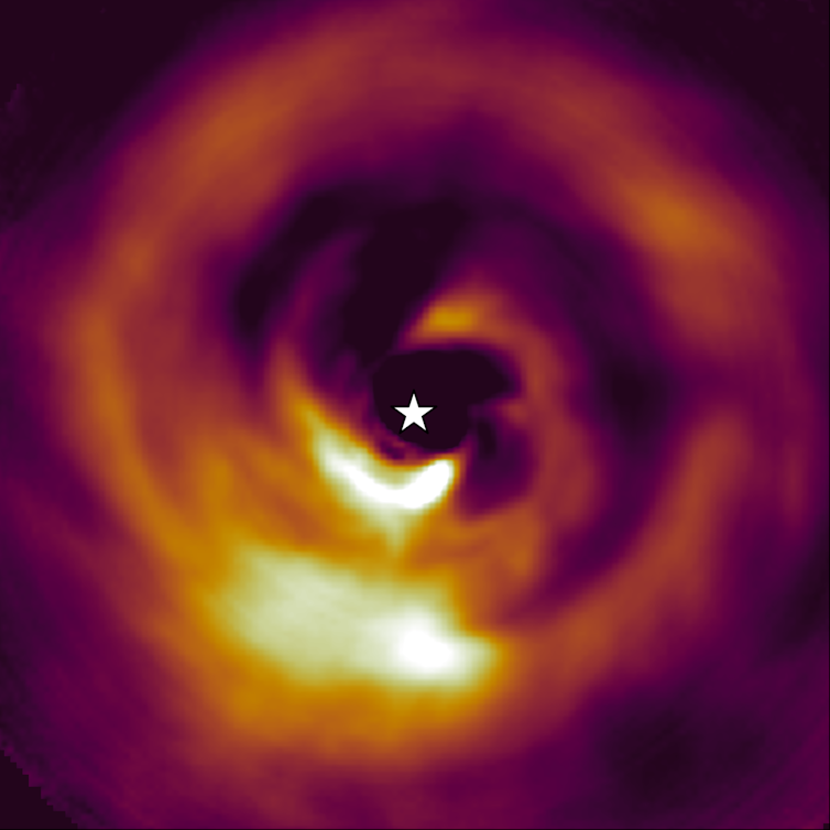 The disk around AB Aurigae. The forming planet is the bright blob at the bottom. Currie et al. / Nature Astronomy, Author provided