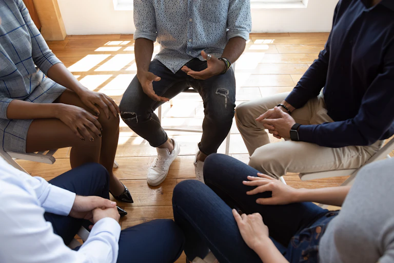 Group of people sitting in a circle