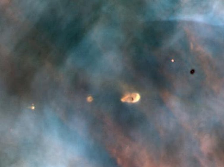 ‘Primordial clouds’ of dust and gas that form planets, in the Orion Nebula. C.R. O'Dell/Rice University; NASA