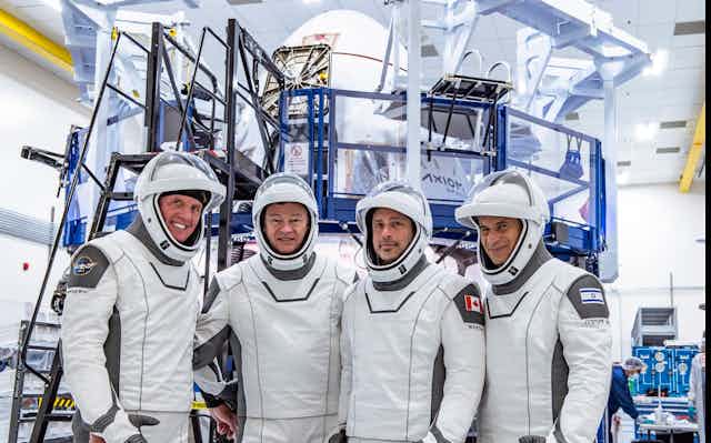 Image of the crew consisting of pilot Larry Connor of the United States, commander Michael López-Alegría of Spain and the United States, and mission specialists Mark Pathy  and Eytan Stibbe from Canada and Israel.