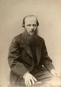 Vintage photograph of man with beard seated.
