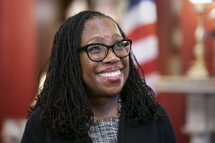 Supreme Court nominee Judge Ketanji Brown smiles.