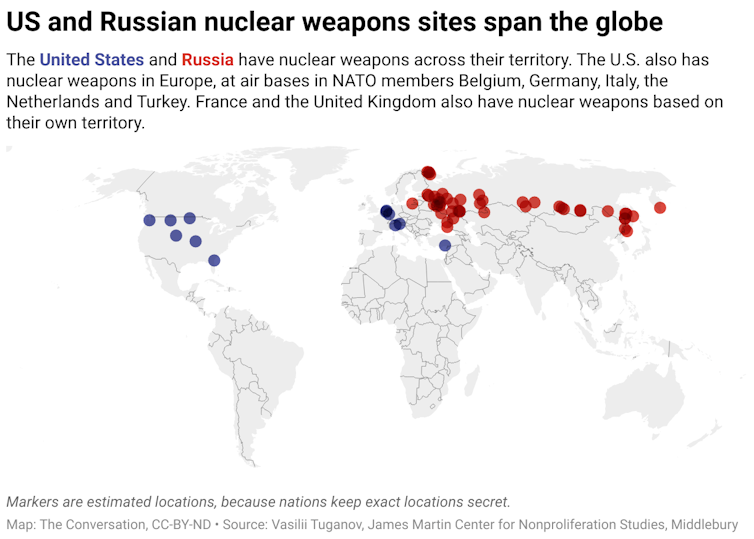 A map of the world with colored dots that correspond to approximately where the United States and Russia have nuclear weapons. The blue dots that correspond to nuclear weapons owned by the U.S. and the red dots correspond to Russia's nuclear weapons.