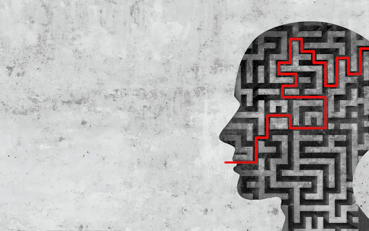 A silhouette of a head with a maze, and a red line going from through the maze from the braid to the mouth