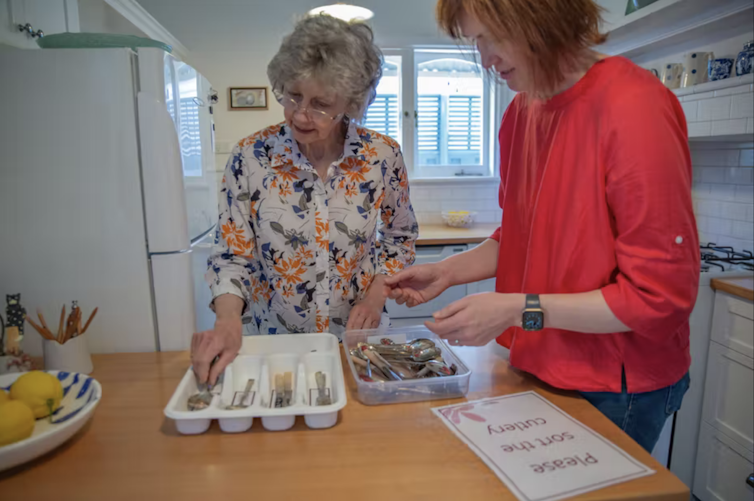 Older woman chooses cutlery