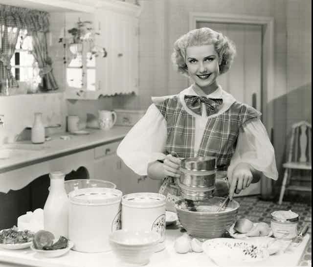 Vintage photo of awoman baking