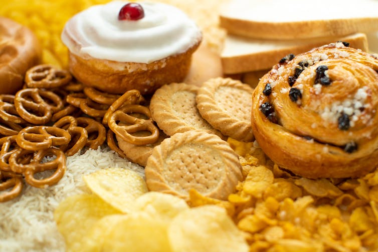 Delicious looking cakes, cookies, pretzels and chips.