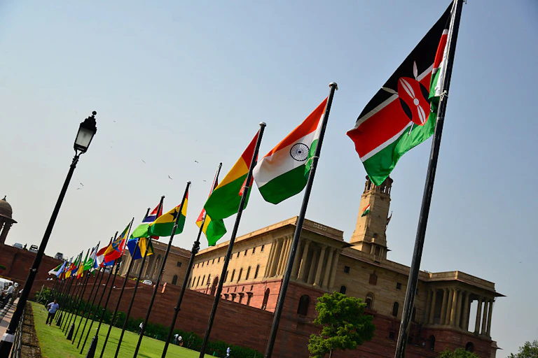 Flags flutter outside a building