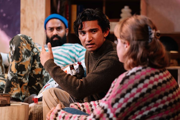 Production image: three people on a couch