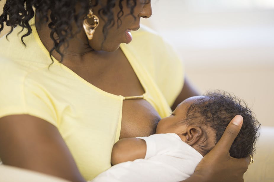 Woman breastfeeding a baby.