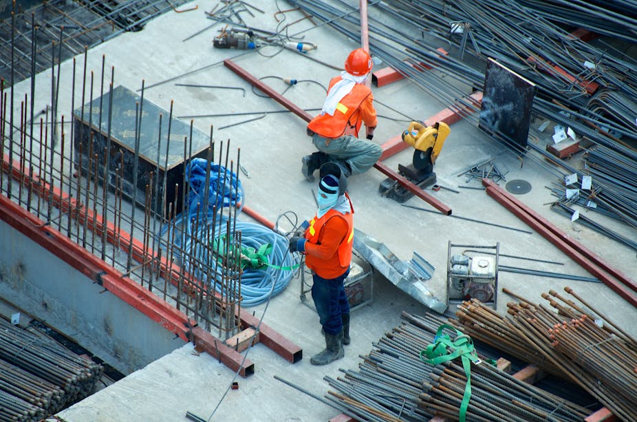 Two workers on a building site