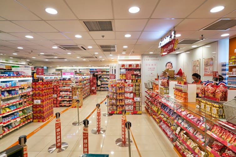 Chocolate and sweets displayed by cash registers in grocery store