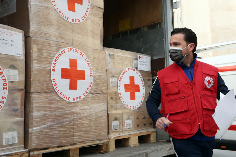 A Red Cross vehicle with boxes of aid for Ukraine.