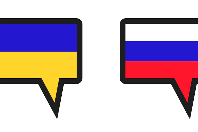 Speech bubbles containing the Ukrainian and Russian flags