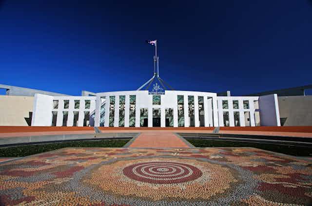 Aboriginal dot painting mural outside Australian Parliament House.