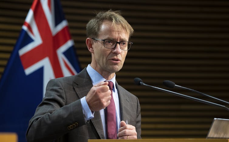 Director-General of Health Ashley Bloomfield speaking at a podium.