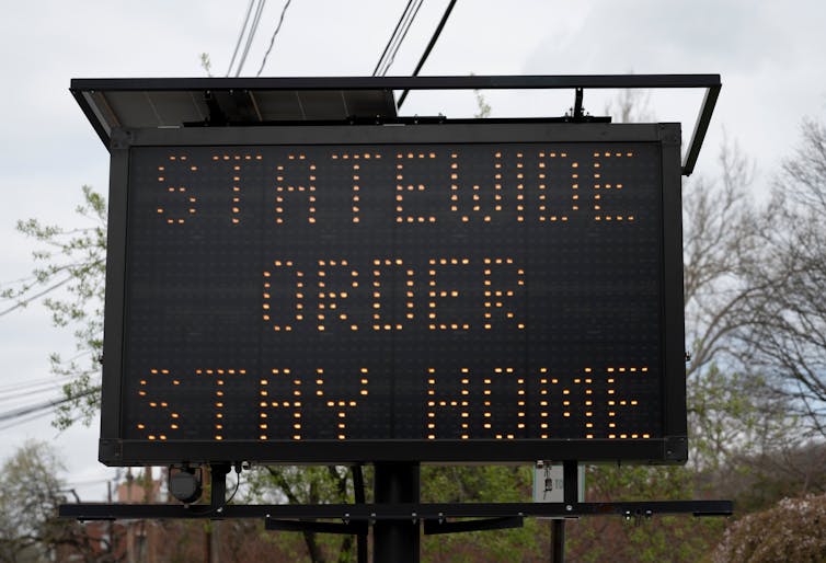 Roadside sign that reads 'Statewide order stay home'