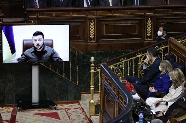 Ukrainian president Volodymyr Zelensky addresses members of Spanish parliament via video link.
