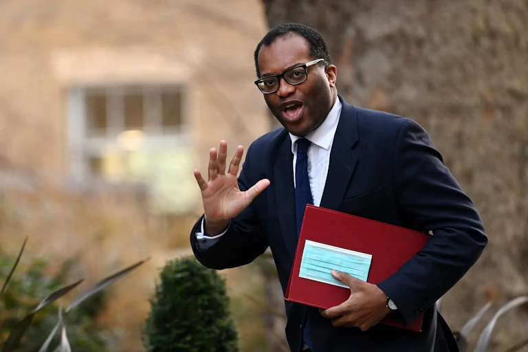 Man in suit with red folder