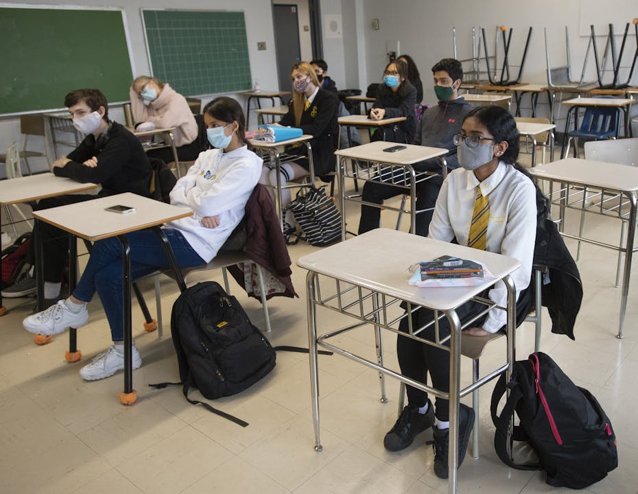 Students seen sitting in a classroom.