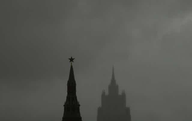 Two towers set against an overcast sky.
