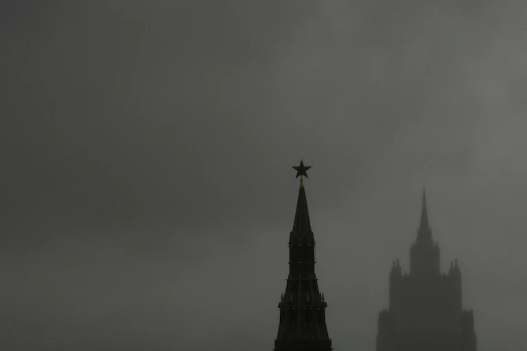 Two towers set against an overcast sky.