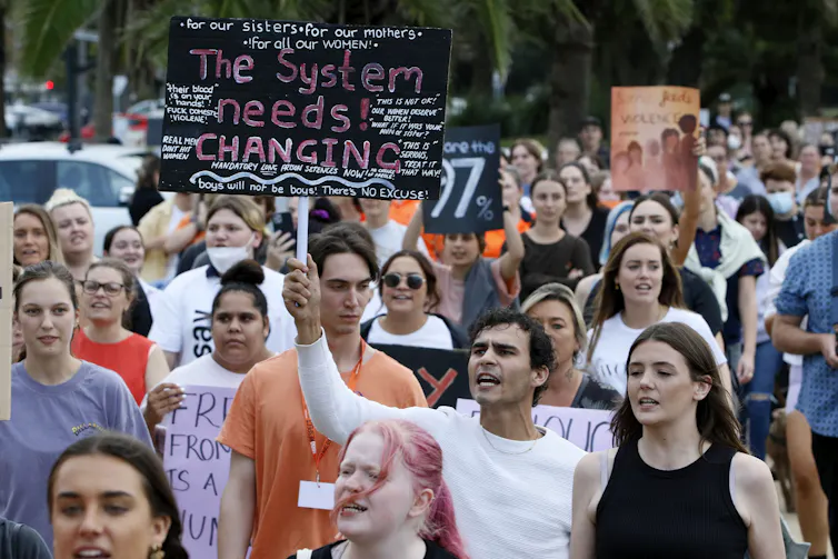 A group of young protesters advocating for systemic political change
