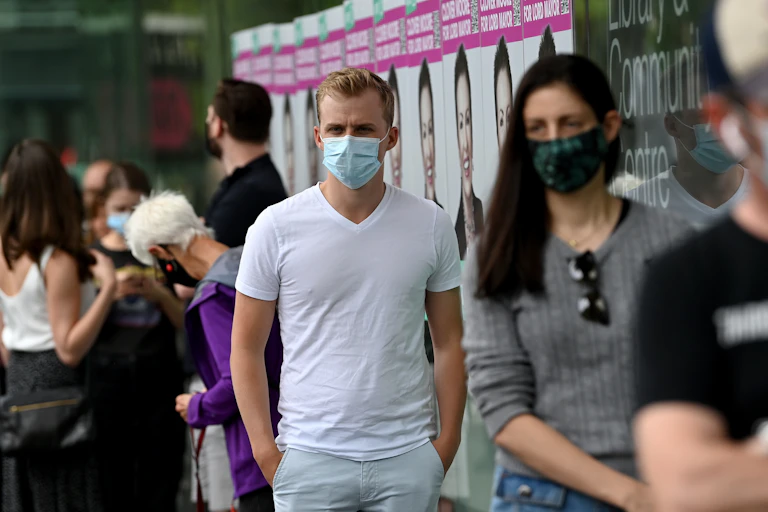 A line of young people waiting to vote in an Australian political election