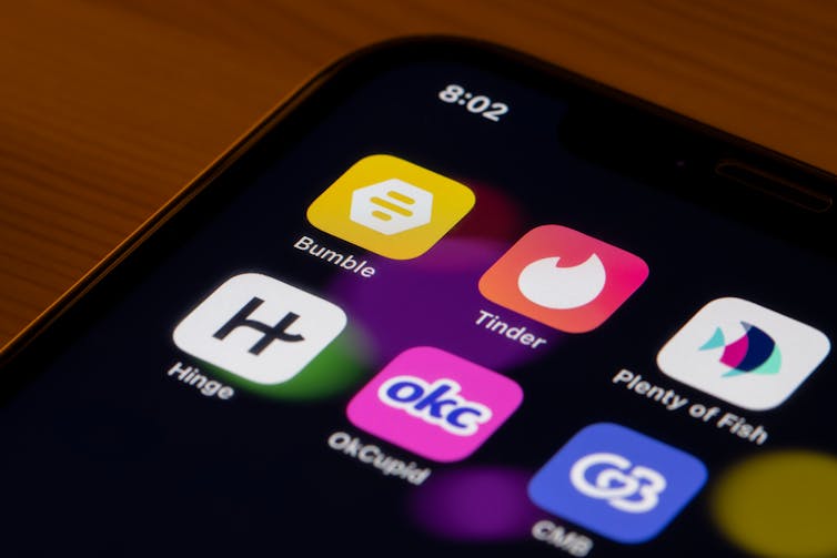 Assorted dating apps are seen on an iPhone - Bumble, Tinder, Plenty of Fish, Hinge, OKCupid (OKC), and Coffee Meets Bagel (CMB).