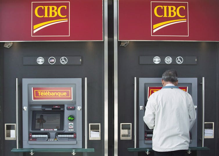 A man using a bank ATM