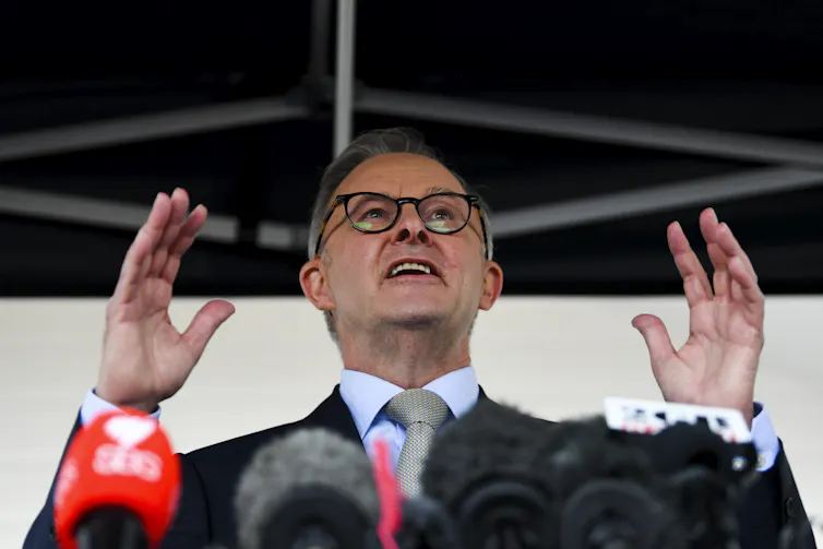 Anthony Albanese standing at a lectern