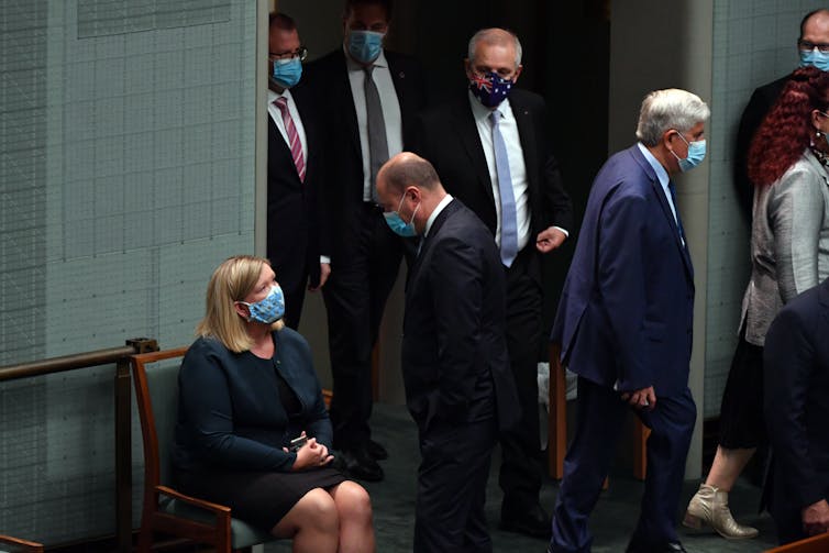 Bridget Archer talks to Josh Frydenberg after crossing the floor.