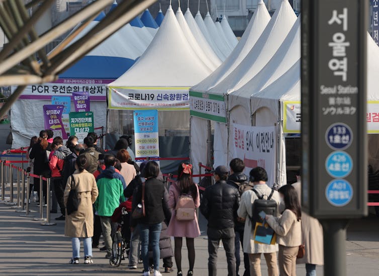 People queueing up at COVID testing tent