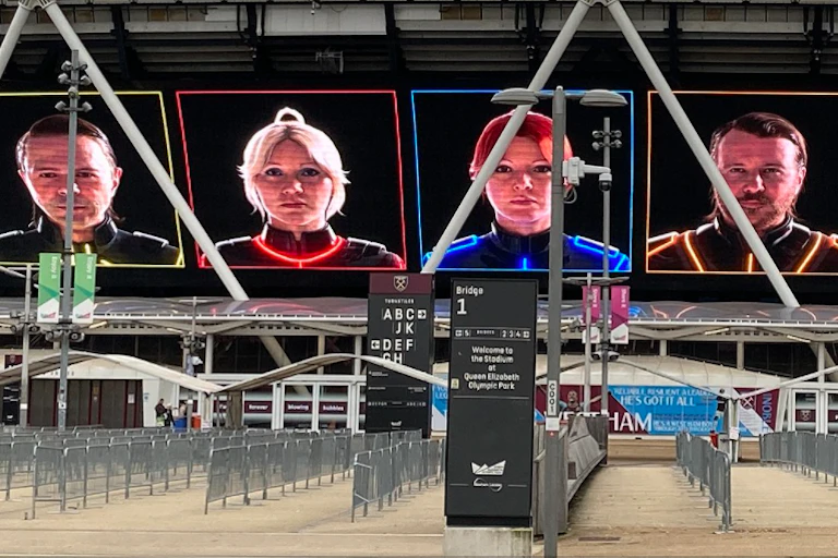 The four avatars of the Abba singers on a hoarding advertising their new show.