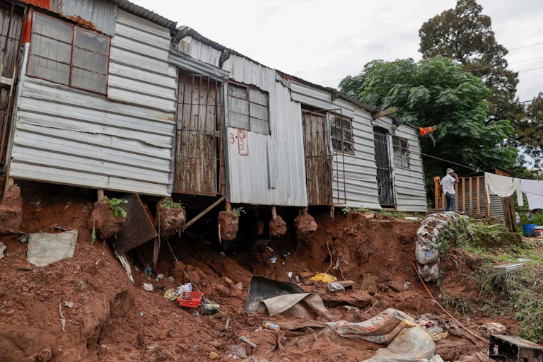 Informal house with structure damage
