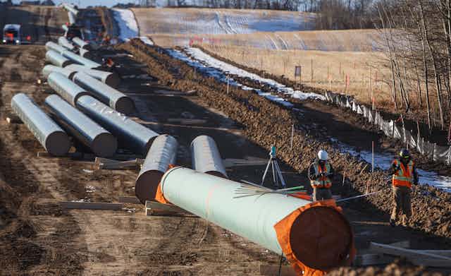 A pipeline under construction near a field in Alberta.